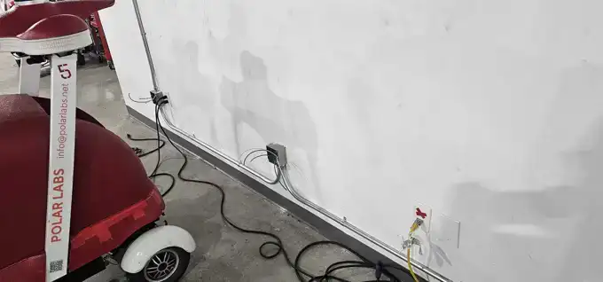 A robot charging on one of our dedicated receptacles.