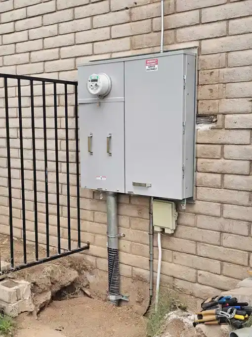 The finished 400A service equipment outside, meter set and released by the utility.